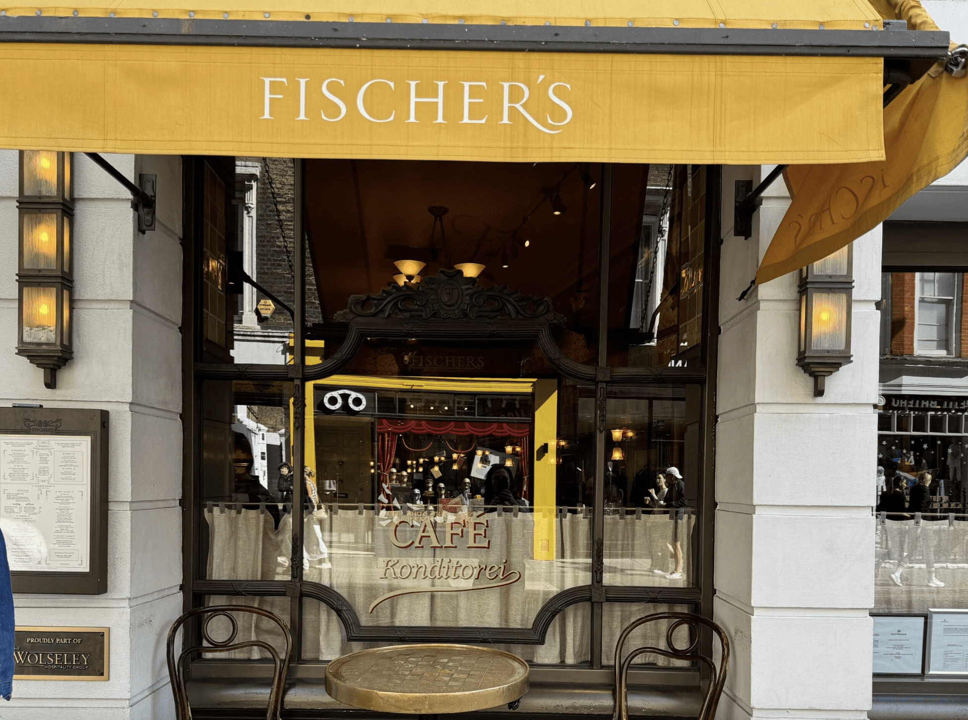 White building with a yellow sign that reads "Fischer's"