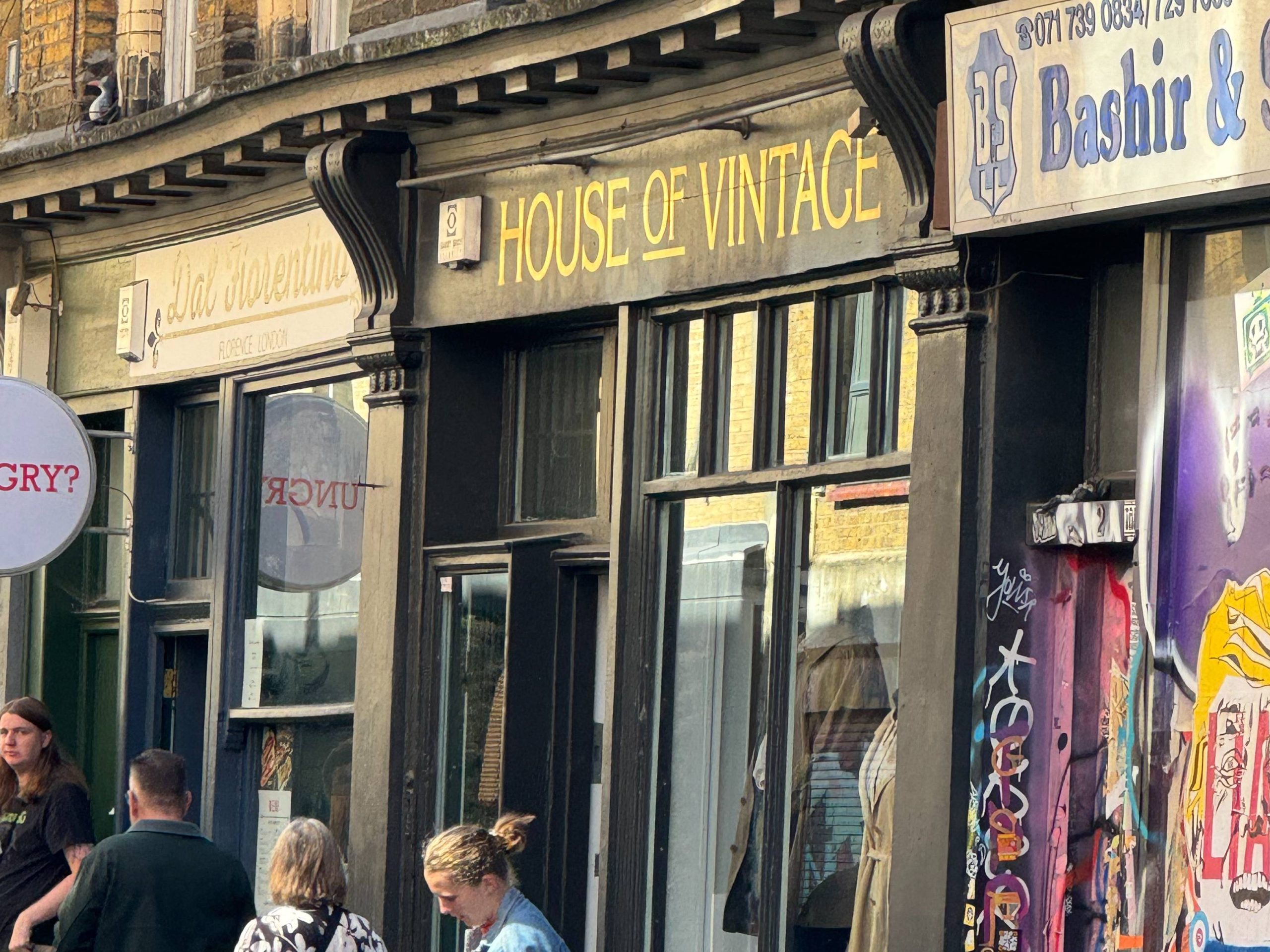 Black sign with yellow font that reads "House of Vintage"