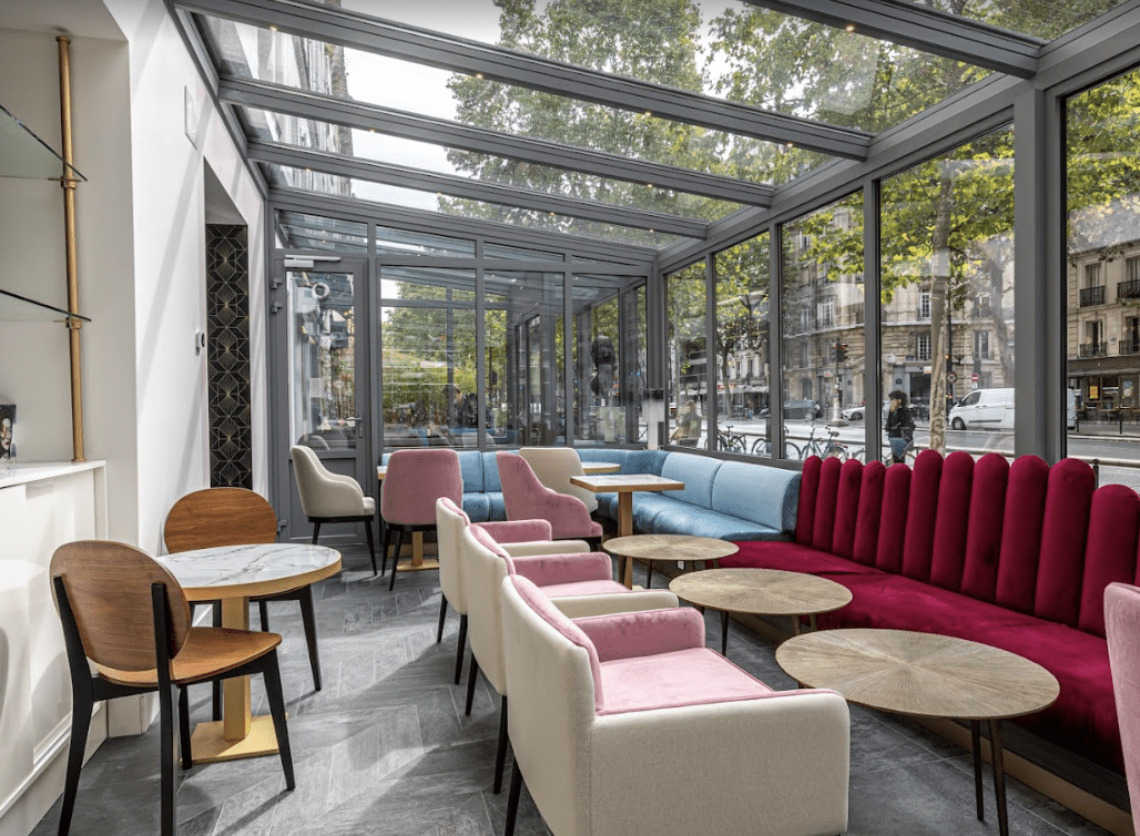 Red velvet sofa in a sunroom restaurant.