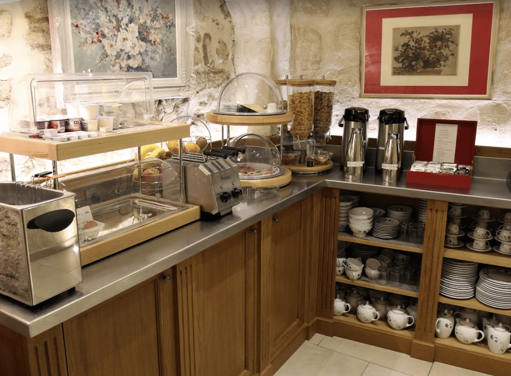 A countertop filled with breakfast food and juice.