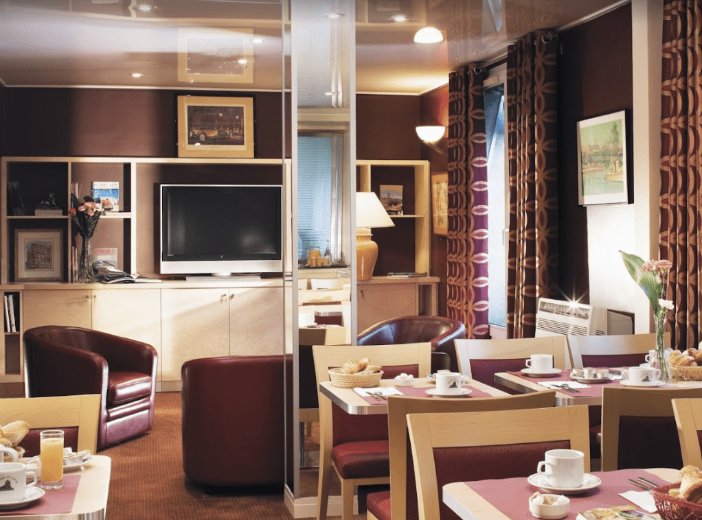 Maroon walls with circle patterned drapes.