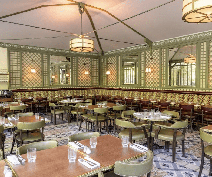 Green paneled walls with green chairs.