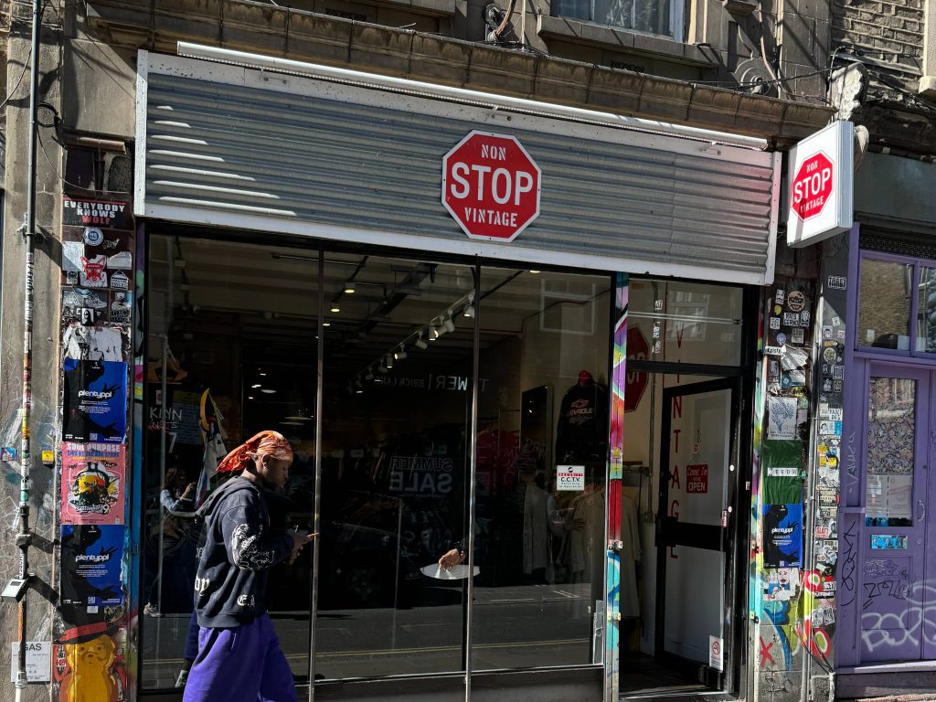 Red Stop sign with white font that reads "Non Stop Vintage"