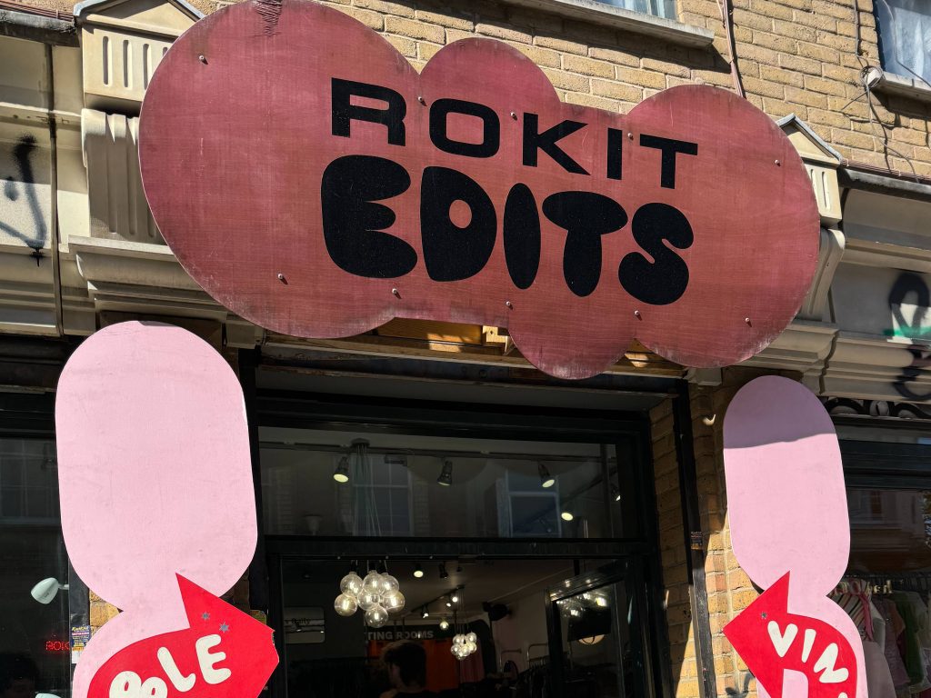 A pink bubble-shaped sign that reads "Rokit Edits"