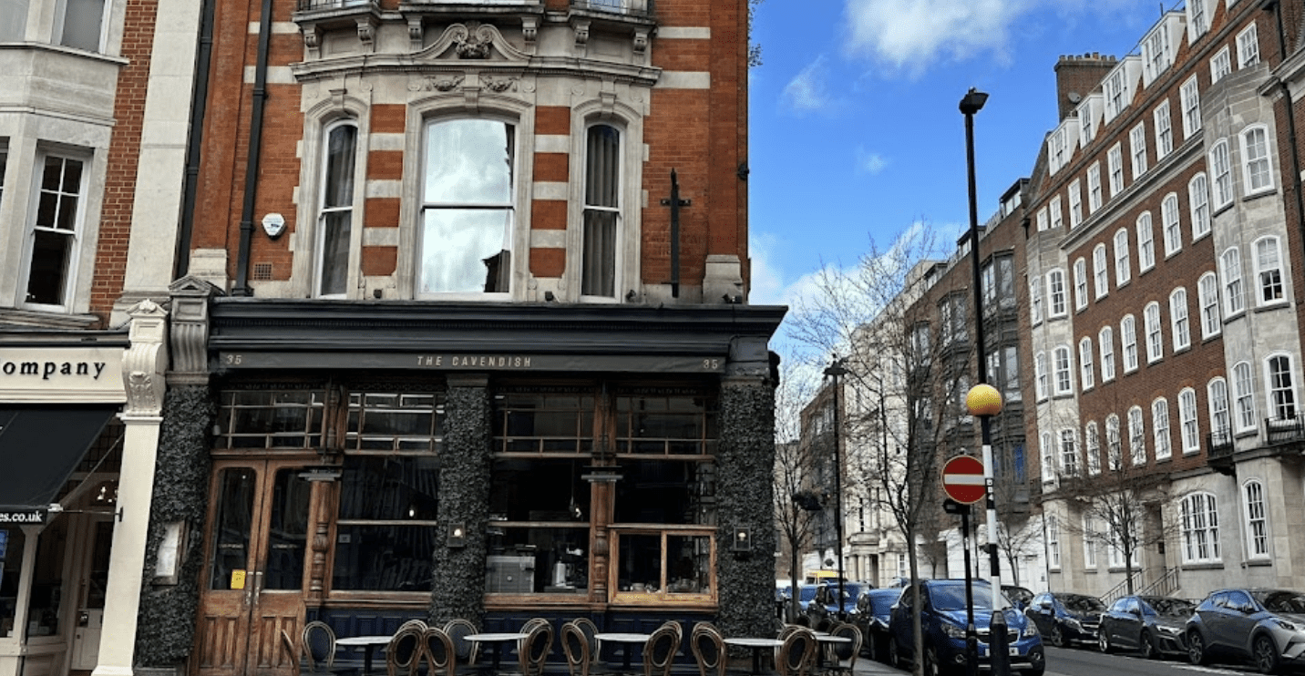 Brick building with a black sign that reads "The Cavendish"