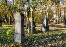 Gravestones topped with crosses in a cemetery