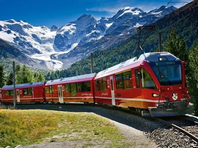 Bernina train with mountains in the background