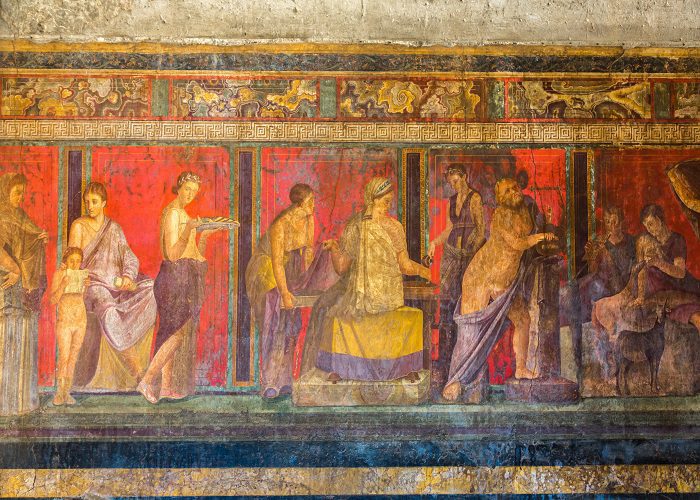 Colorful fresco in the villa dei misteri in the Pompeii Archaeological Park.