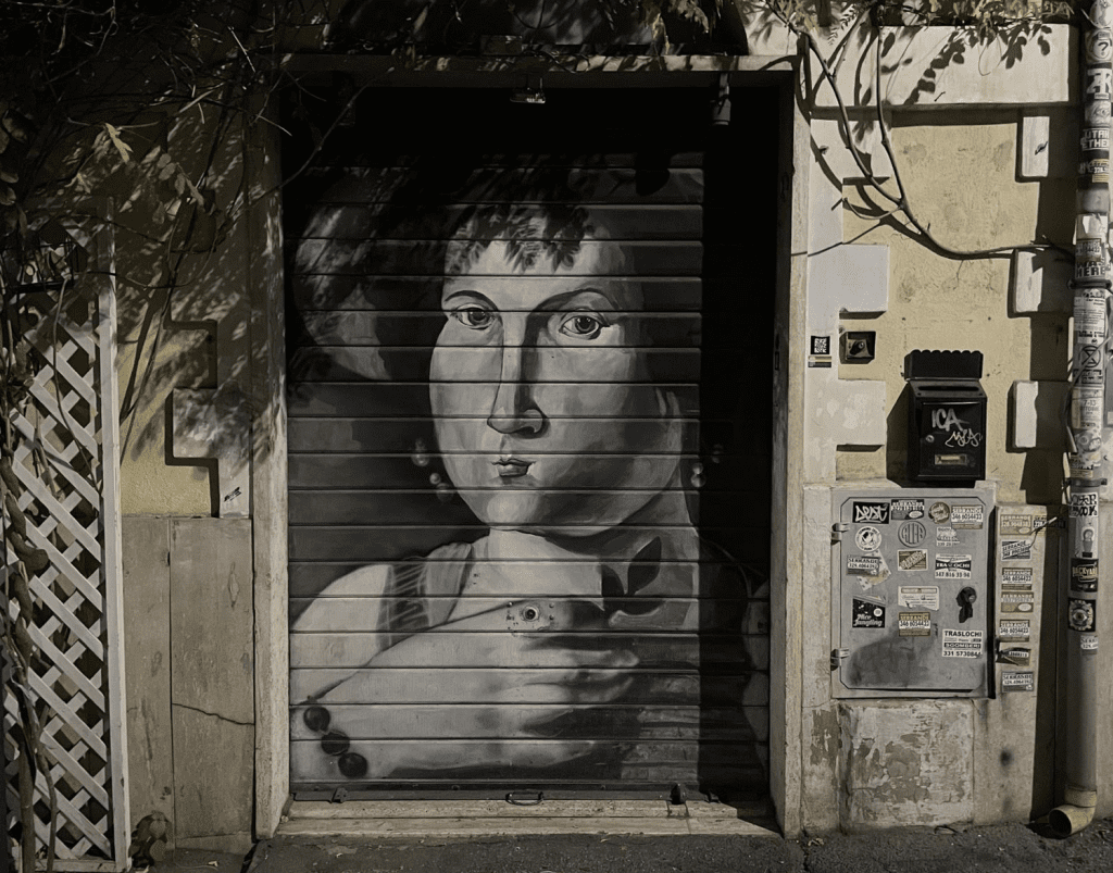 A black and white mural painted on a wall.