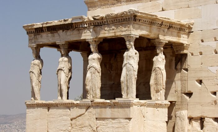 Six caryatid statues supporting the porch of the Erechtheion on the Acropolis in Athens, Greece