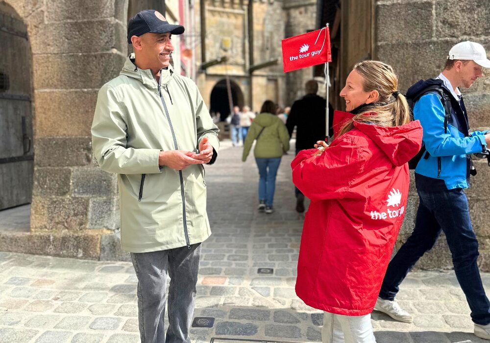 Tour guide with guest in Mont Saint Michel