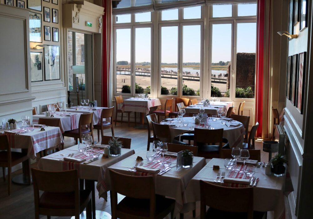 Inside of Hotel La Mère Poulard with view of water